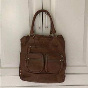 Tan leather shoulder bag with front pockets